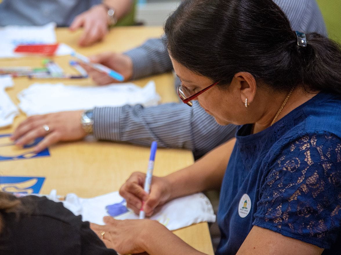 A volunteer fills out a form