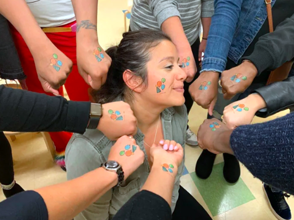 A woman with face paint at a Foundation Bright Space